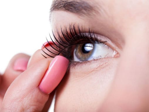 applying false eyelash in advanced makeup artist course