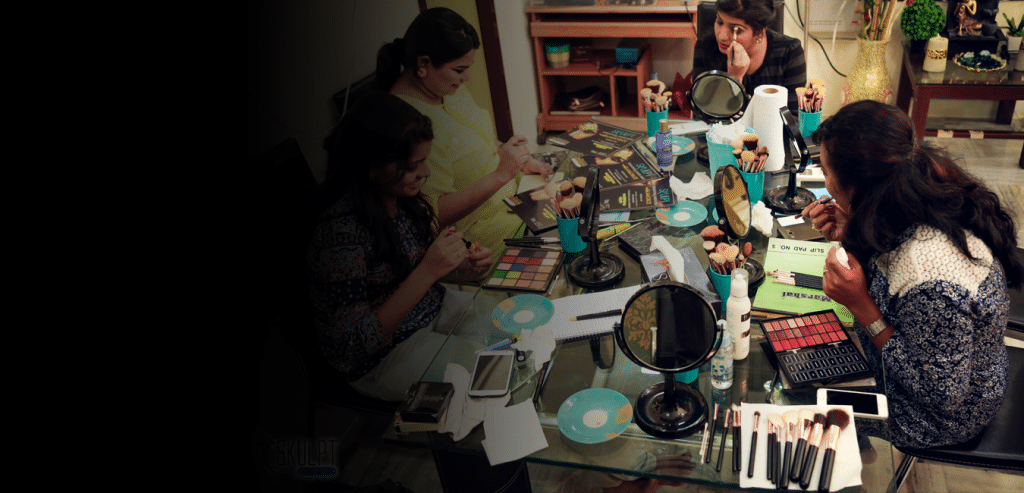 Slider image of makeup teacher training her student to become makeup artist.Makeup lessons at Skulpt